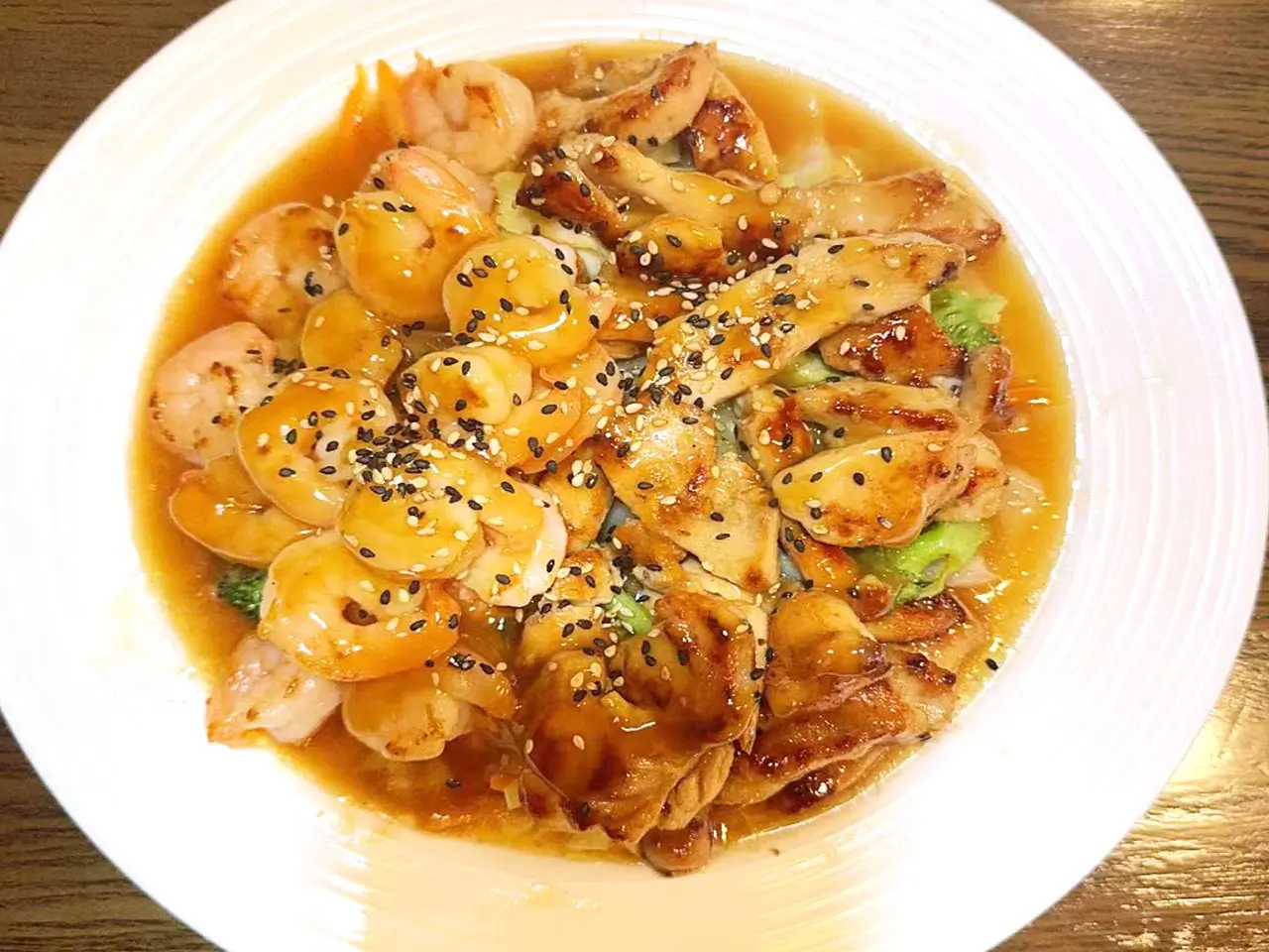 Shrimp Chicken Stir - Fry Juicy shrimp, chicken, veggies in flavorful sauce at Sakura, a Japanese restaurant in Clark